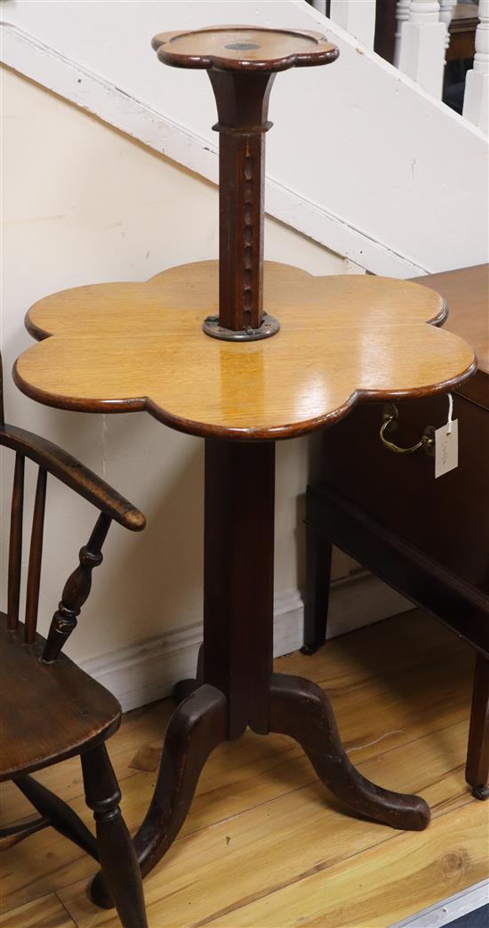 An oak metamorphic tripod table W.65cm